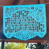 Personalized papel picado design with a hummingbird, flowers, and a heart. Design original to Ay Mujer Shop