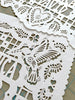 Personalized papel picado design with a hummingbird, flowers, and a heart. Design original to Ay Mujer Shop